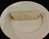 A picture of step 18 of Crab and Shrimp Enchiladas with Hatch Chili Sauce.