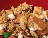 A picture of step 5 of Buddy the elf Chex mix.