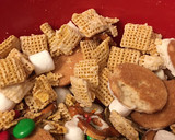 A picture of step 5 of Buddy the elf Chex mix.