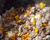 A picture of step 2 of Zucchini Tomato Italian Sausage Soup.