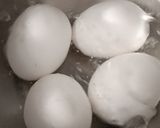 A picture of step 1 of Achari Egg Biryani.