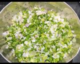 A picture of step 1 of Masaledaar Green onion with potatoes.