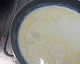 A picture of step 8 of Spinach Corn Ravioli in white sauce.