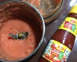 A picture of step 2 of Chatpata Bread Upma in red sauce.