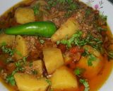 A picture of step 6 of Aloo qeema.