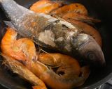 A picture of step 2 of Acqua pazza with sea bass and prawns in 30 mins! + Delicious pasta idea using remaining soup.