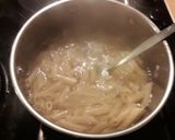 A picture of step 2 of Penne pasta in basil pesto.