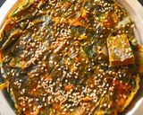 A picture of step 3 of Arbi leaves crispy squares.