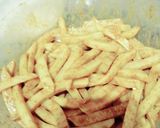 A picture of step 3 of Masala French fries.