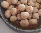 A picture of step 5 of Chicken Meatballs in Chinese Orange Sauce.