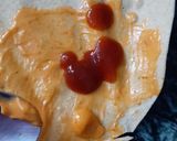 A picture of step 5 of Tortilla Wrap with egg and veggies.