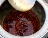 A picture of step 1 of Desi Masar and moong daal Mix on wood fire.