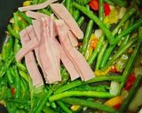 A picture of step 3 of Fried Green Beans with Ham & Radish Greens.