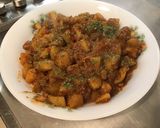 Une image de l'étape 11 de Pommes de terre sautées aux tomates, ail et épices.