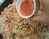 A picture of step 11 of Thai style fried rice with pineapple.