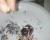 A picture of step 4 of 1 bite chocolatey marshmallow pops.