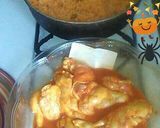 A picture of step 1 of Yellow rice w carrots and sauces n spicy buffalo wing.