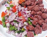 A picture of step 3 of Alexandrian Hawawshi with Sausage.