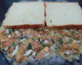 A picture of step 8 of Chicken Omlate covered sandwiches.