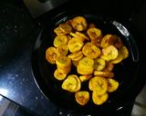 A picture of step 5 of Fried rice plantains and fried chicken.