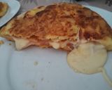 Foto del paso 6 de la receta: Tortilla de papas rellena de jamón y queso