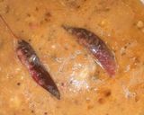 A picture of step 3 of Dal fry fried bhindi papad and plain rice.
