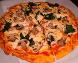 A picture of step 6 of Polenta Pizza with Mushrooms and Spinach.