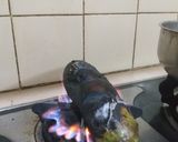 A picture of step 1 of Baingan ka Bhurta.