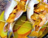 Foto del paso 12 de la receta: Dorada al horno con langostinos macerados y patatas guisadas
