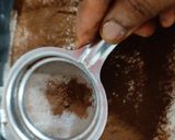 A picture of step 5 of Tiramisu with whipping cream.