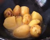 A picture of step 1 of Chicken biryani with potatoes.