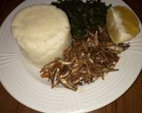 A picture of step 4 of Ugali,Omena and Greens,Served with an Orange fruit.
