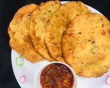 A picture of step 4 of Patheera with onion sauce.