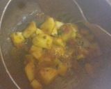 A picture of step 3 of Rote with spicy aloo gravy.