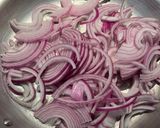 A picture of step 1 of Pear, Gorgonzola and Red Onion Pizza.