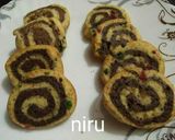 A picture of step 12 of Swiss roll tutti frutti cookies.