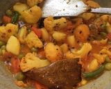 A picture of step 4 of Gobhi Matar Curry.
