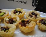 A picture of step 13 of Raisins-Pistachio Baklava.