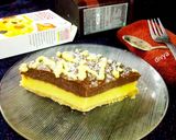 A picture of step 7 of Yakult Tripe layered choco custard biscuit cake.