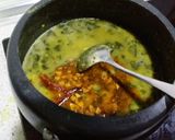 A picture of step 8 of Moogdal with spinach.