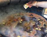 A picture of step 8 of Paella with Vegetables and Meat.