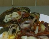 A picture of step 2 of Fried Tilapia fish with onion sauce.