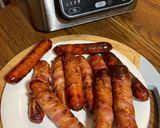 A picture of step 2 of Bacon wrapped cheddar Brats.