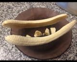A picture of step 1 of Healthy banana split boat for breakfast. With granola and almond butter.