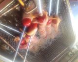 A picture of step 3 of Deep-Fried, Bacon-Wrapped Hot Dogs on Skewers.