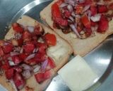A picture of step 4 of Tomato Bruschetta on a Tawa.