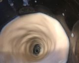 A picture of step 3 of Thandai with rose petals.
