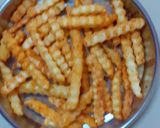 A picture of step 6 of Peri peri fries.