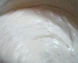 A picture of step 2 of Sponge cake filled with chunky blue berry jam.