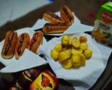 A picture of step 4 of Hotdog's in two ways and some fried potatoes.
